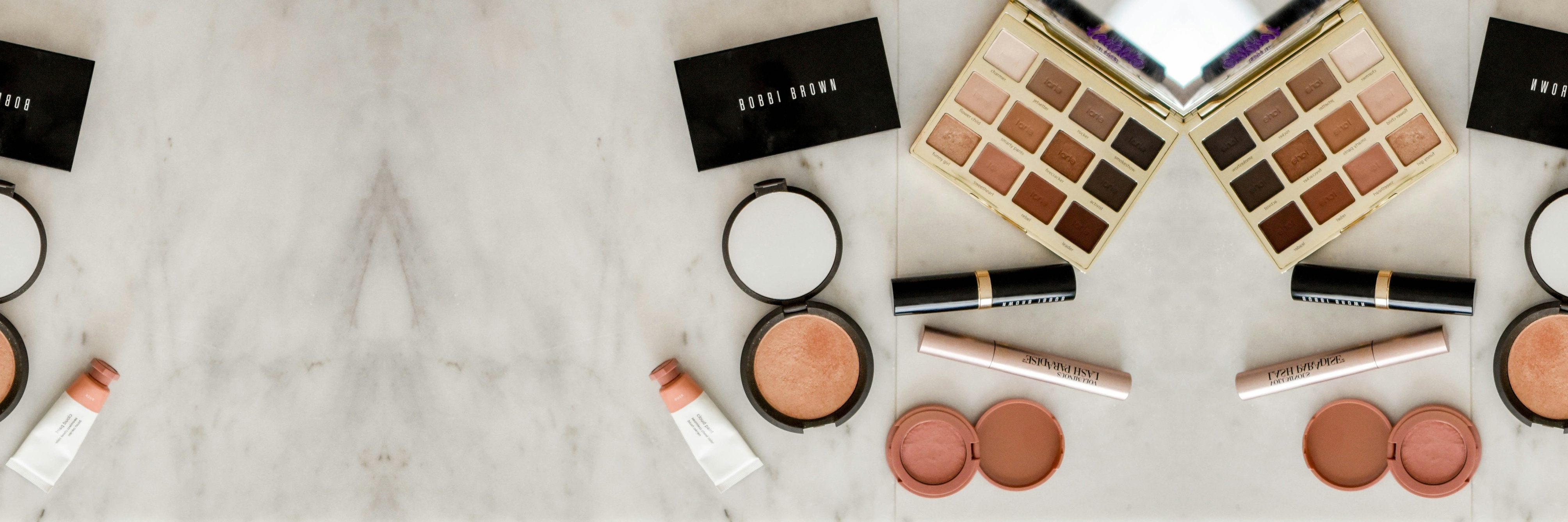 Assorted cosmetics displayed on a table